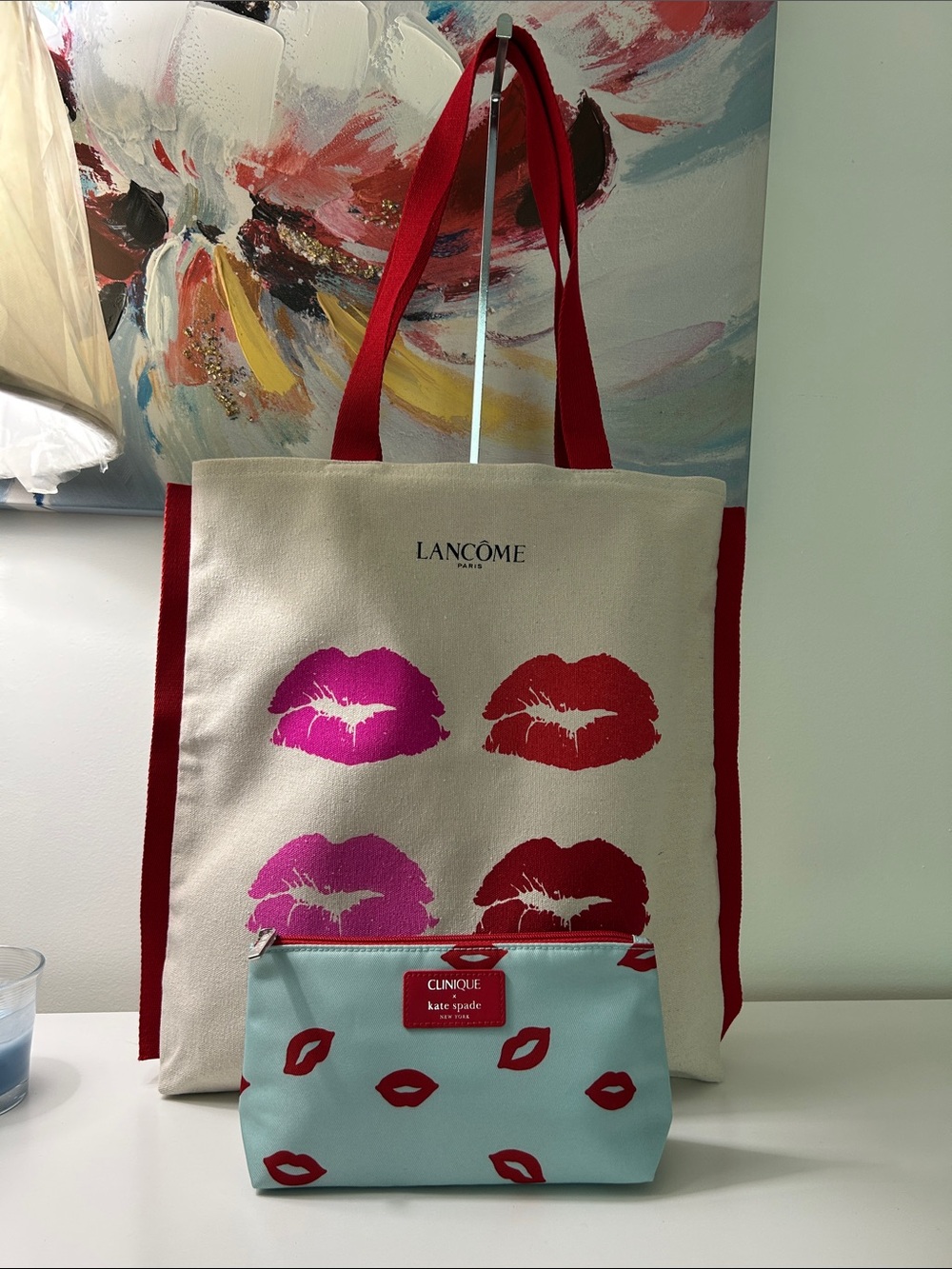 Lancôme Cream Canvas Tote with Red and Pink Lip Prints and Clinique Make up Bag